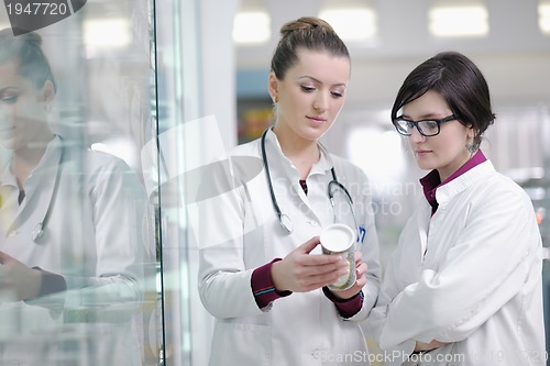 Image of team of pharmacist chemist woman  in pharmacy drugstore