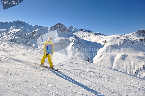 Image of skiing on fresh snow at winter season at beautiful sunny day