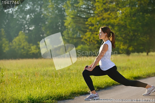 Image of woman stretching before fitness