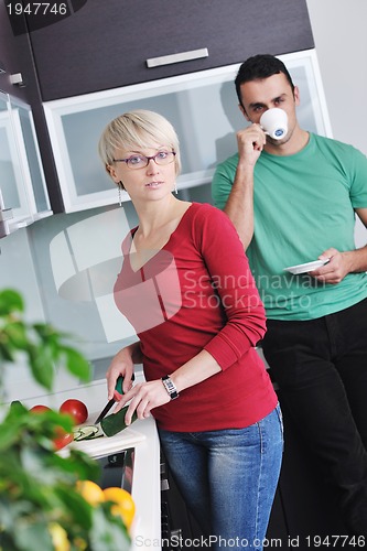 Image of young couple have fun in modern kitchen