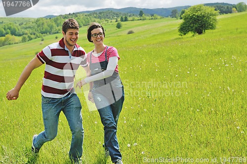 Image of romantic young couple in love together outdoor