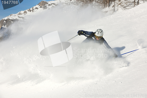 Image of skiing on fresh snow at winter season at beautiful sunny day