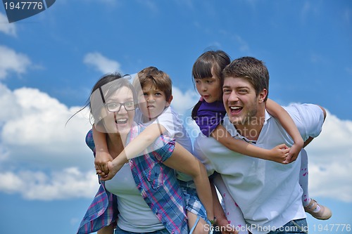 Image of happy young family have fun outdoors