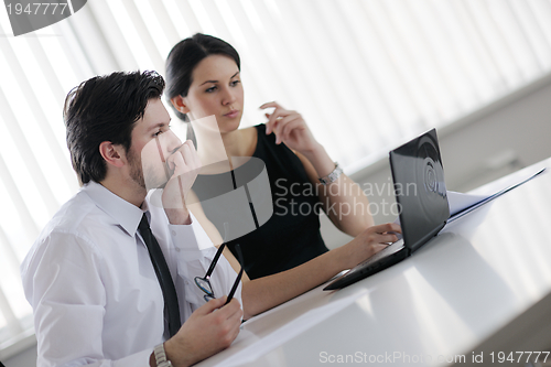 Image of business people in a meeting at office