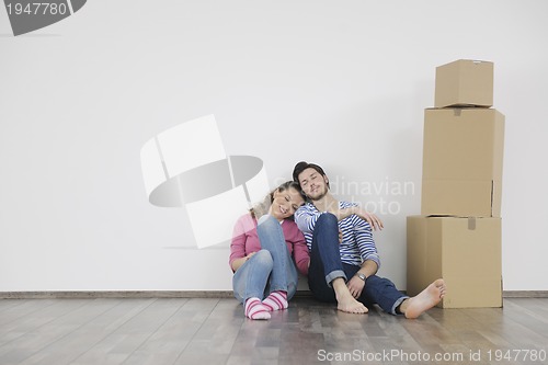 Image of Young couple moving in new home