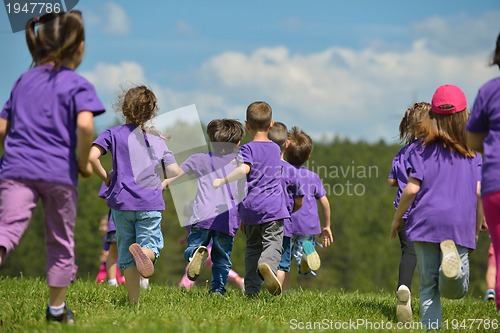 Image of happy kids group  have fun in nature