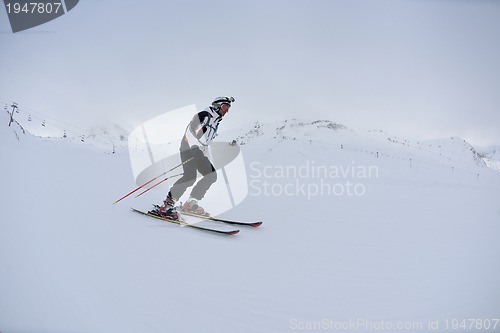 Image of skiing on fresh snow at winter season at beautiful sunny day