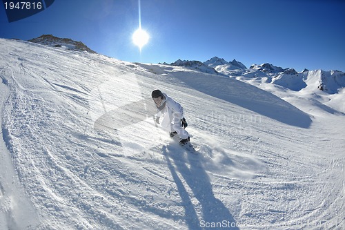 Image of skiing on fresh snow at winter season at beautiful sunny day