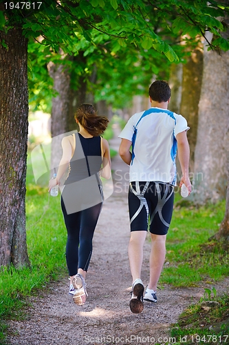 Image of Young couple jogging