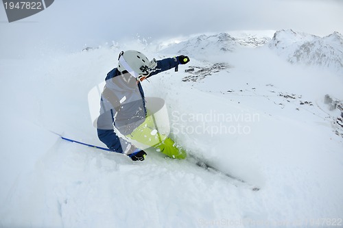 Image of skiing on fresh snow at winter season at beautiful sunny day