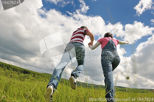 Image of romantic young couple in love together outdoor