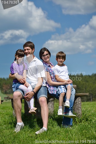 Image of happy young family have fun outdoors