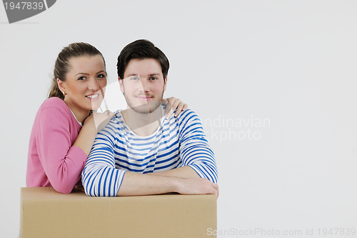 Image of Young couple moving in new house