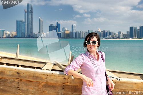 Image of happy tourist woman