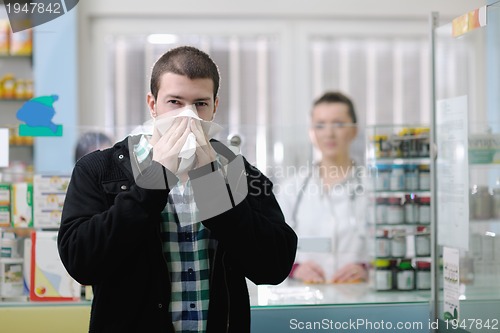 Image of pharmacist suggesting medical drug to buyer in pharmacy drugstor