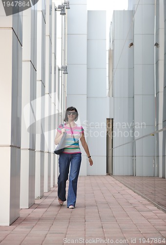 Image of beautiful young woman in the city