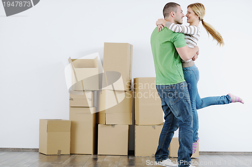 Image of Young couple moving in new house