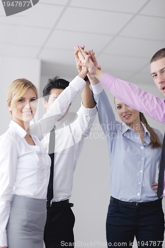 Image of business people group joining hands