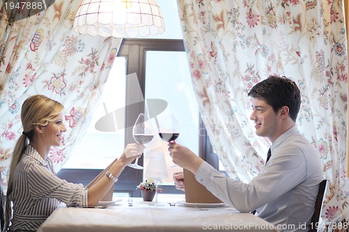Image of young couple having dinner at a restaurant