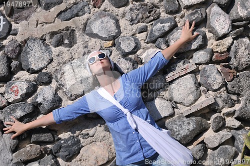 Image of Greek woman on the streets of Oia, Santorini, Greece