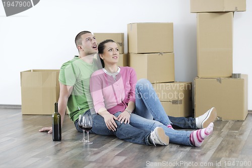 Image of Young couple moving in new home