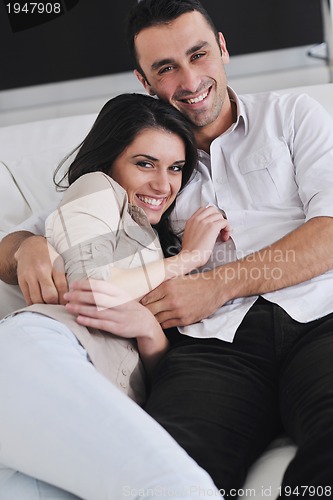 Image of happy young couple relax at home