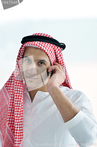 Image of arab business man at bright office