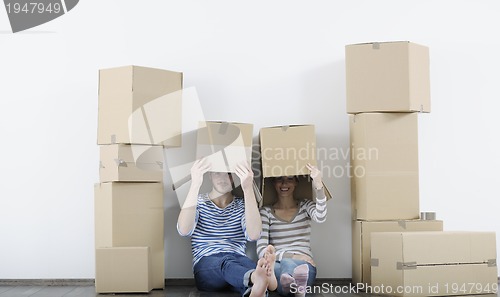 Image of Young couple moving in new home