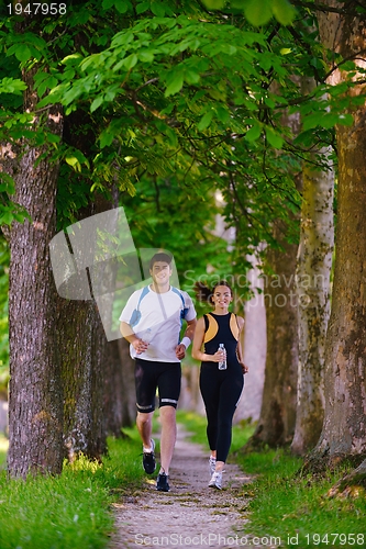 Image of Young couple jogging