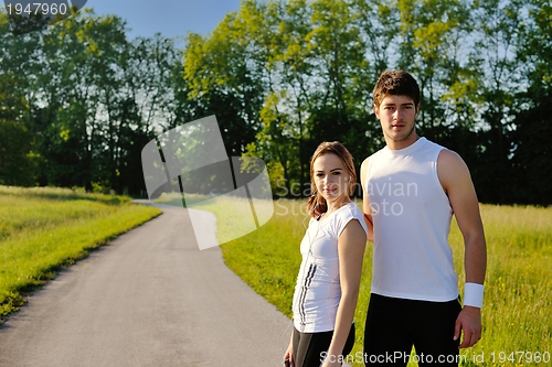 Image of Young couple jogging