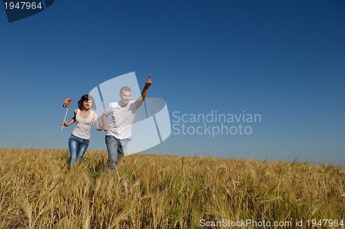 Image of happy couple in wheat field
