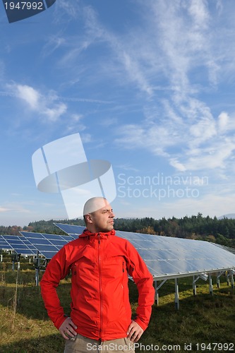 Image of Male solar panel engineer at work place