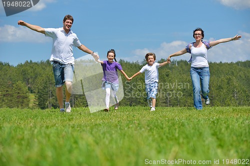 Image of happy young family have fun outdoors