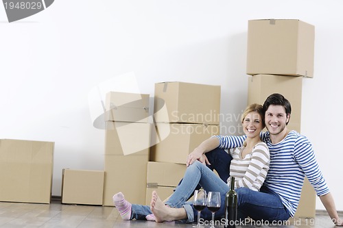Image of Young couple moving in new home