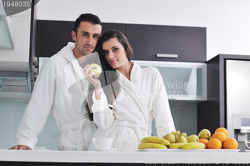 Image of young couple have fun in modern kitchen