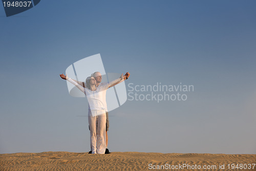 Image of couple enjoying the sunset