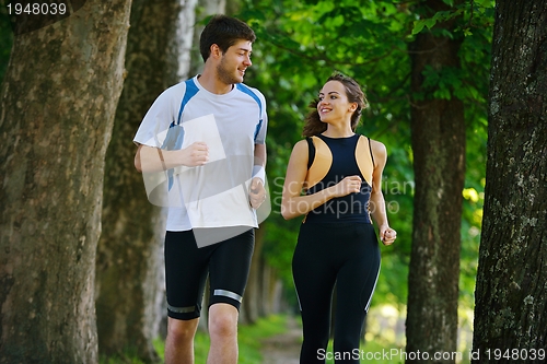 Image of Young couple jogging