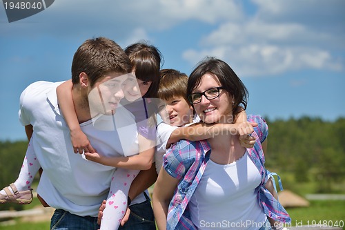 Image of happy young family have fun outdoors