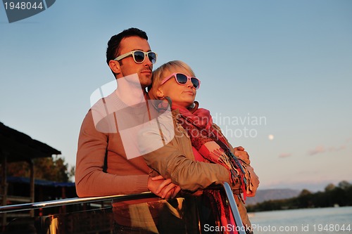 Image of couple in love  have romantic time on boat