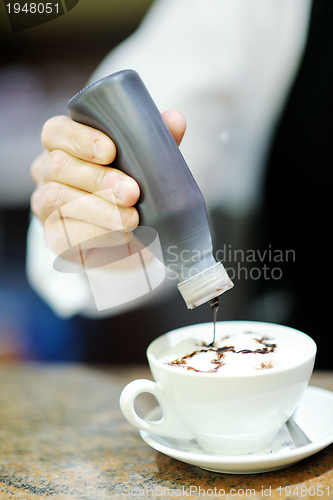 Image of Barista prepares cappuccino