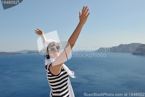 Image of Greek woman on the streets of Oia, Santorini, Greece