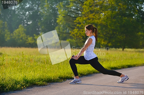 Image of woman stretching before fitness