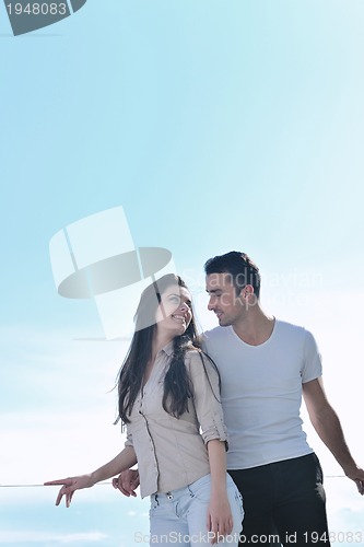 Image of couple relaxing on balcony