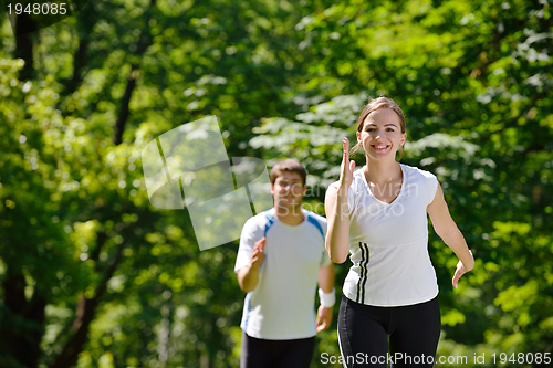 Image of Young couple jogging