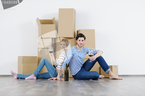 Image of Young couple moving in new house