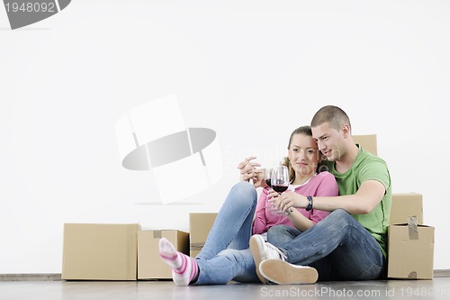 Image of Young couple moving in new home