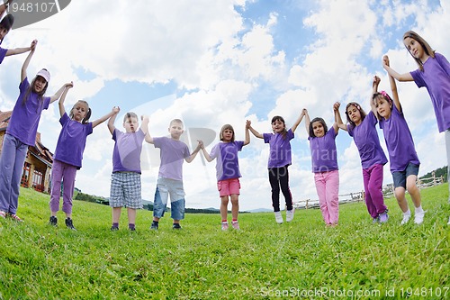 Image of happy kids group  have fun in nature