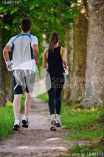 Image of Young couple jogging