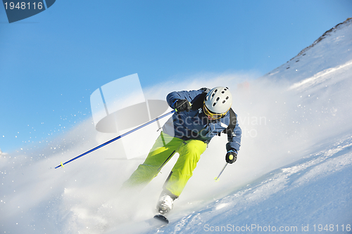 Image of skiing on fresh snow at winter season at beautiful sunny day