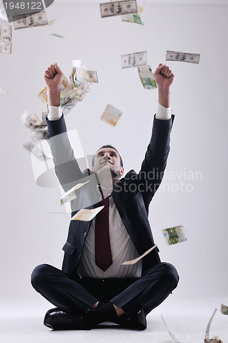 Image of Business man holding money